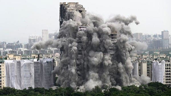 Watch 3700 kilos of dynamite demolish two skyscrapers in less than 10 seconds