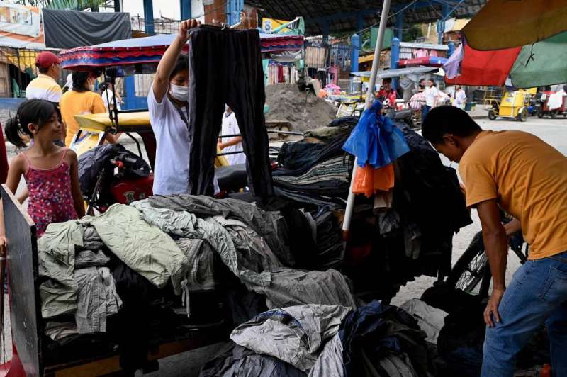 Dozens of people were hurt in a scramble for benefits ahead of the resumption of schools in the Philippines.