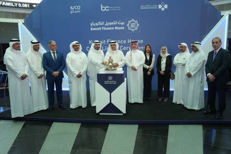 Hamad Al-Marzouq rings the bell to start trading the shares of “KFH” on the Bahrain Bourse