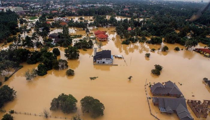 Floods sweep over 20 locations in the western coast of the Malaysian state of Sabah