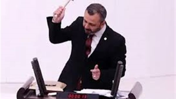 Turkish deputy breaks his phone in Parliament in protest against a new law