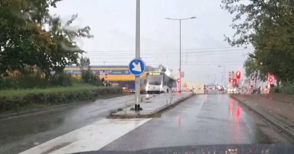 Video: Dutch train slams into empty bus, splitting it in two