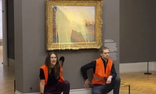 German police arrest climate protesters after throwing mashed potatoes at Claude Monet’s painting