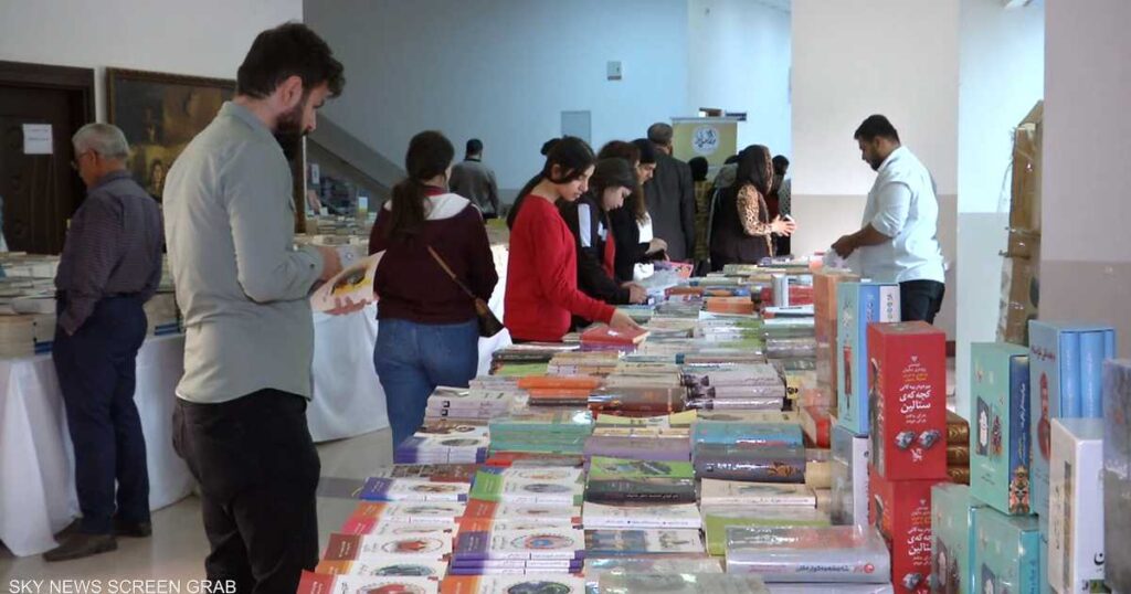 Photographer reports to promote peaceful coexistence .. The “Different” book fair in Erbil