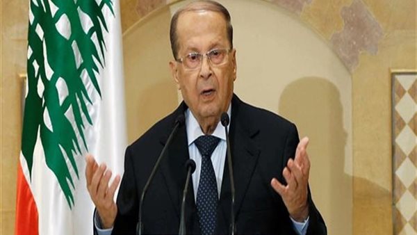 Lebanese President Michel Aoun signs the resignation decree of Naguib Mikati before leaving his post