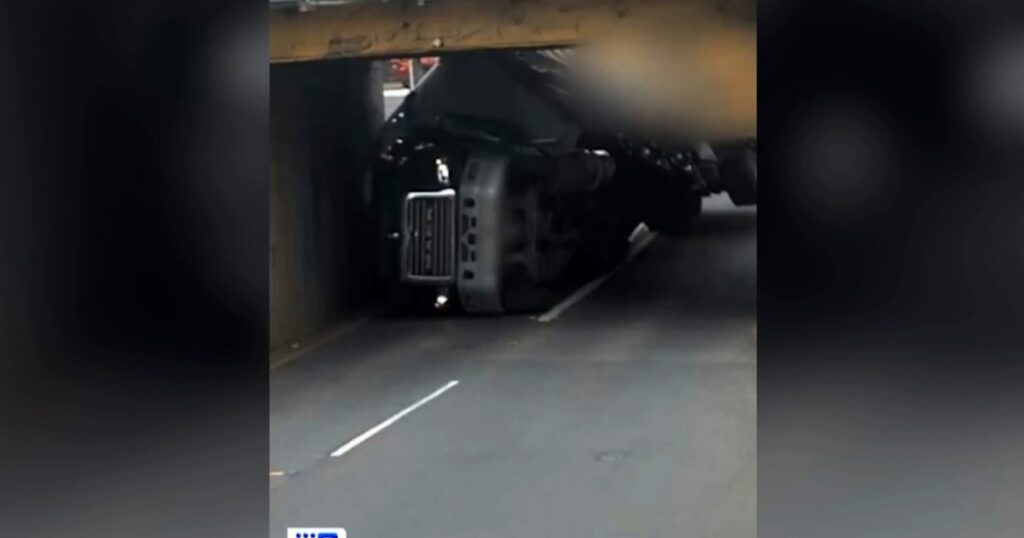 Watch: Brisbane truck slams into rail overbridge