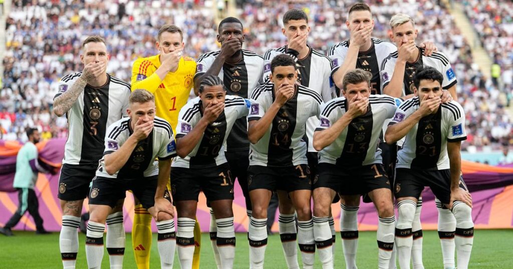 Germany players cover mouths at World Cup in FIFA protest