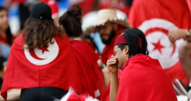 Sadness and sorrow over the faces of the fans of Tunisia after the loss from Australia in the World Cup .. Pictures